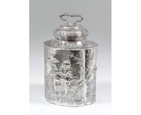 A late 19th Century Continental silver oval lobed tea caddy and domed cover with folding handle, the whole embossed and chase