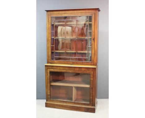 A George III mahogany bookcase inlaid with ebonised stringing and crossbanded, the upper part with plain cornice, fitted thre