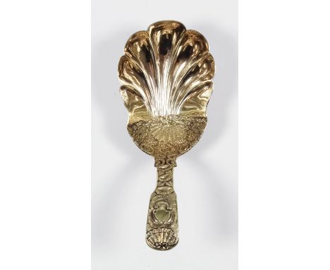 A George IV silver gilt caddy spoon with deep shell bowl, the handle and rear of the bowl crisply chased with floral and shel