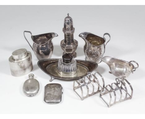 An Edward VII silver oval boat shaped inkstand (to hold one oval inkwell) with pierced sides and gadroon mounts to rim, on fo