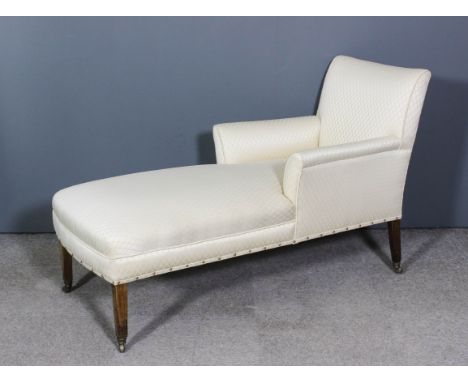 A late Georgian mahogany day bed/chaise lounge, upholstered in cream silk, on square tapered legs and casters