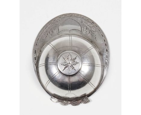 A George III silver "Jockey's Cap" caddy spoon, the top of the cap and trim engraved with leaf ornament and with vacant shiel