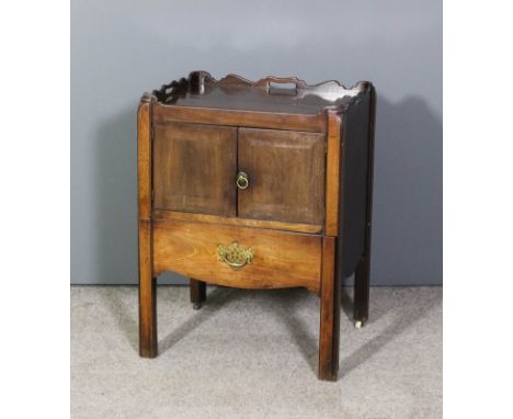 A George III mahogany rectangular tray top commode with shaped gallery enclosed by a pair of doors, on square legs, 22.5ins w
