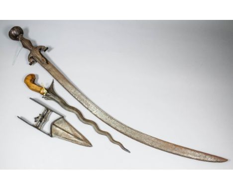 Three Far Eastern edged weapons, comprising - a 13.5ins water steel blade with carved hardwood handle, 17.5ins overall, an In