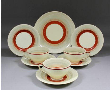 A Susie Cooper maroon banded pottery part tea service, comprising - six tea cups, six saucers, six tea plates and bread and b