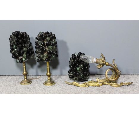 A gilt metal single wall light of French design, with coloured glass 'Grape' shade, two similar pedestal lamps, each 11ins hi