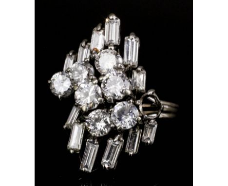 A 1950s 18ct white gold mounted all diamond set ring, the face set with seven brilliant cut diamonds, each approximately .25c