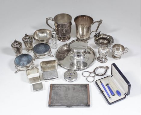A George V silver christening mug, the body with moulded girdles and strapwork decoration, 3.75ins high, one other George V p