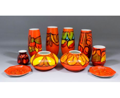 Six Poole pottery vases of tapering form, each decorated with a "Delphis" design, 9ins high, two similarly decorated squat gl