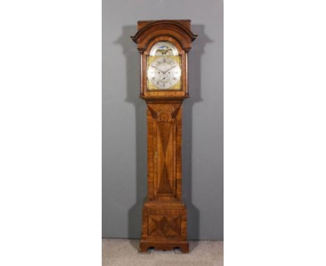 An 18th Century "North Country" oak longcase clock by John Fletcher of Holbeck, the 12ins arched brass dial with silvered cha