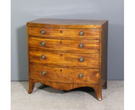 A George III mahogany bow-fronted chest of drawers of small proportions, the top with square edge fitted four long graduated 