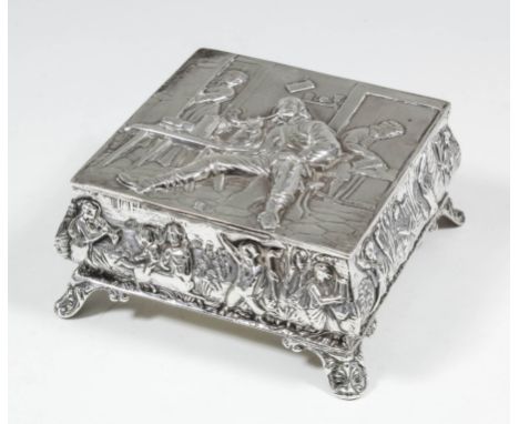 A late Victorian silver square trinket box, the lid embossed with figures in a tavern, the sides embossed with classical figu