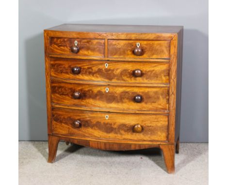 A George III mahogany bow-fronted chest of drawers with square top edge, fitted two short and three long drawers, with ivory 