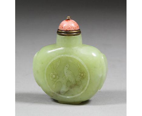 A Chinese green celadon jade snuff bottle of flattened bulbous form, the face carved with a bird on a flowering branch and th