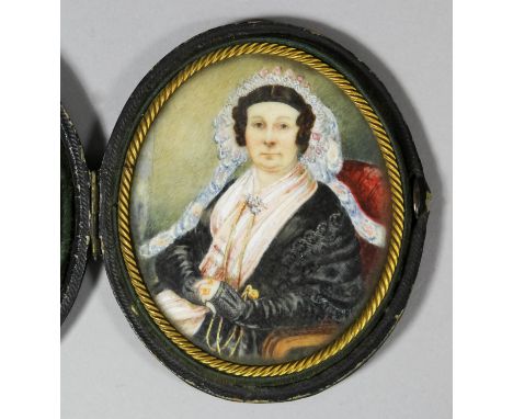 19th Century English School - Miniature oval half length portrait of a middle aged woman wearing a lace bonnet and black lace