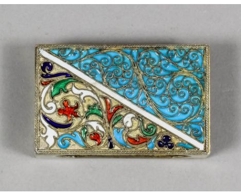 An early 20th Century Russian silver gilt and enamel rectangular matchbox cover decorated with various colours with bold leaf