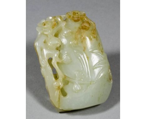 A Chinese pale celadon jade rectangular pendant with slight brown inclusions, pierced and carved with a flowering tree and wi