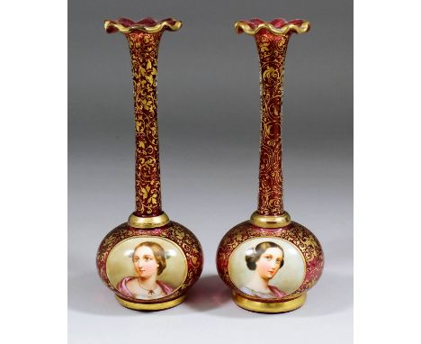 A pair of 19th Century Bohemian cranberry coloured glass vases, each enamelled in colours with a portrait of a young woman on