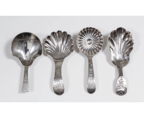 A George III silver caddy spoon, the shield shaped bowl engraved with oval cartouched, engraved handle with angular terminal,