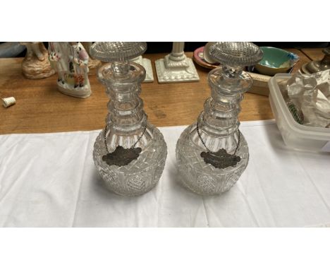  Sale Item:    2 CUT GLASS DECANTERS WITH SILVER LABELS (AF)  Vat Status:   No Vat   Buyers Premium:  This lot is subject to 