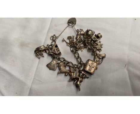  Sale Item:    CHARM BRACELET SOME SILVER   Vat Status:   No Vat   Buyers Premium:  This lot is subject to a Buyers Premium o