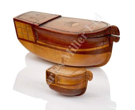 A WOODEN SAILORWORK TOBACCO BOX, carved in contrasting woods in the form of a man o'war with hinged deck forming lid -- 5¼in.