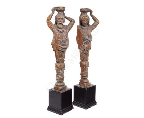 A PAIR OF NORTHERN EUROPEAN MERCHANT MARINE TERMS OR SUPPORTS, POSSIBLY 18TH CENTURY, the male with finely carved beard and t