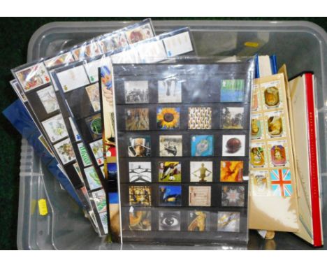 Box containing loose stamps, first day covers, Royal Mail mint stamp collectors packs, Circa 1990, various stamp albums.