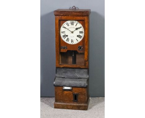 An oak and black metal cased clocking in machine by the "Time Recorder Supply and Maintenance Company, 159 Grange Road, Londo