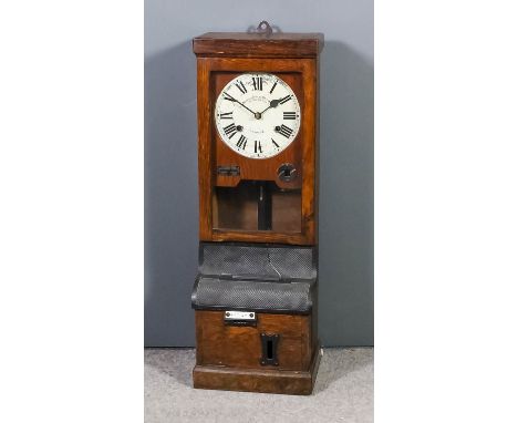 An oak and black metal cased clocking in machine by the "Time Recorder Supply and Maintenance Company, 159 Grange Road, Londo