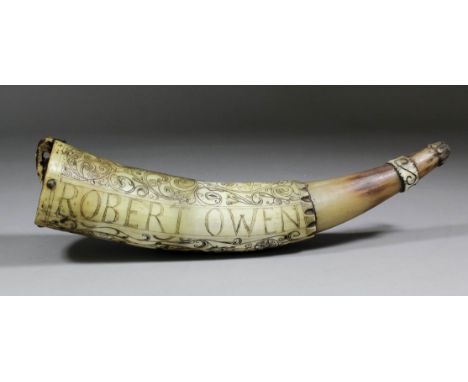 A 17th/18th Century horn powder flask engraved with stylised motifs and worded "Robert Owen, His Horn", 12ins long