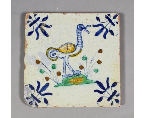 A 17th century Dutch Delft maiolica polychrome tile of a long necked bird with a worm and with barbed corners, 5ins square