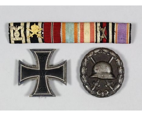 A German Imperial World War I Iron Cross First Class with original attachment pinned to back, an Imperial German World War I 