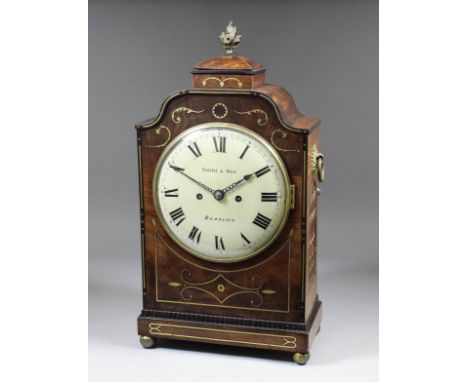 An early 19th Century brass inlaid mahogany mantel clock by Smith & Son of Reading, the 8ins diameter slightly domed metal di