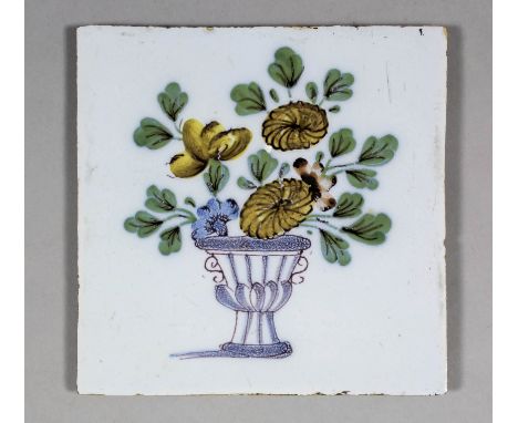 An 18th Century English Delft polychrome tile painted in Fazakerly colours of a vase of flowers, 5ins square (Liverpool - cir
