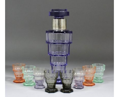 A 1920s mauve tinted glass and plated mounted decanter and stopper of inverted step form, 11ins high overall, and eight match