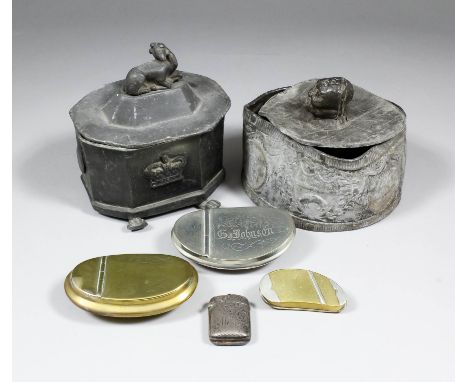 A late 18th Century oval cast lead tobacco box and tamper, the sides with central crest and standing figures and ships, 5.5in
