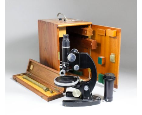 A 1950s Cooke, Troughton & Simms polarising petrographic microscope, Serial M702945, with spare eyepieces / lenses, 13ins hig