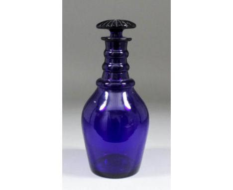 A late 18th Century English blue glass "Prussian" three ring decanter with mushroom stopper, 10ins high