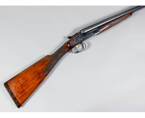 A 12 bore side by side side lock shotgun by Brno, Serial No. 1009943-79, the 28.5ins blued steel barrels with flat rib, blued