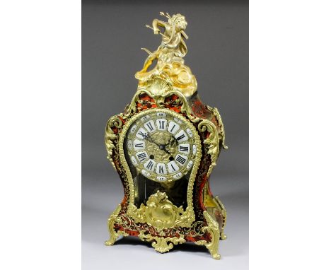 A French red tortoise-shell Boulle and gilt brass mounted mantel clock of Louis XV design, the 7ins diameter cast gilt brass 