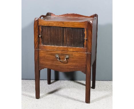 A George III mahogany tray top bedside cabinet, with tambour front and pull-out commode drawer with later top, on square cham