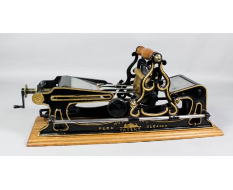 An unusual Victorian cast iron framed "Hutchinson's Patent" fork cleaning machine on mahogany base, 22ins wide x 7ins deep x 