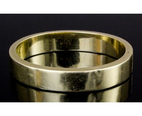 A modern 14ct gold stiff pattern bangle (gross weight 35.4 grammes)