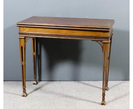 An early 20th Century mahogany rectangular card table of "Chippendale" design, the baize lined folding top with moulded edge,