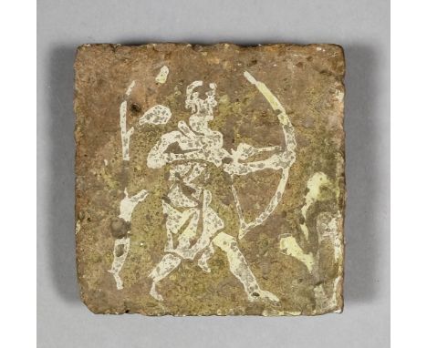 A French Medieval encaustic tile decorated with a white slip inlay of a hunter with bow and arrow, 4ins square (14th Century)