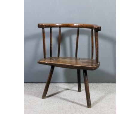 A late 17th/early 18th Century "Primitive" oak, ash and elm seated stick back chair with curved crest rail and wood seat, on 