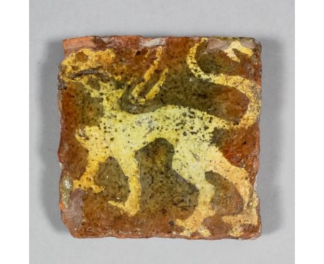 A French Medieval encaustic tile decorated with a white slip inlay of a mythical beast, 3.75ins square (14th/15th Century)