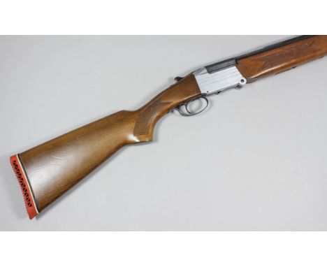 A 12 bore folding over and under shotgun by Investarm, Serial No. 325933, the 24.75ins blued steel barrels with ventilated to