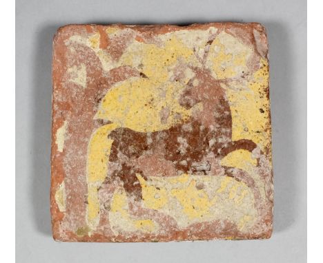 A French Medieval encaustic tile decorated in reversing technique of a stag in flight, 5ins square (late 15th Century)